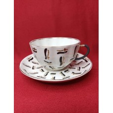 This vintage cup and saucer was made at Lomonosov porcelain factory, Leningrad, USSR, in the 1960s