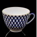 This cobalt net porcelain cup and saucer will complement any meal - whether it is an ordinary tea party with friends or a holiday feast. The set was m